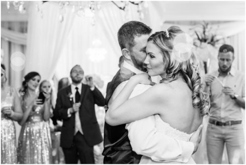 Bride and groom walking on dock at Crystal Ballroom Wedding