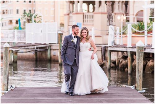 Bride and groom walking on dock at Crystal Ballroom Wedding
