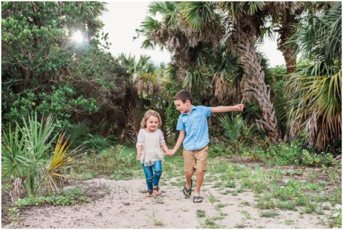 Melbourne Family Photographer brother and sister holding hands on path photo by Liz Cowie Photography