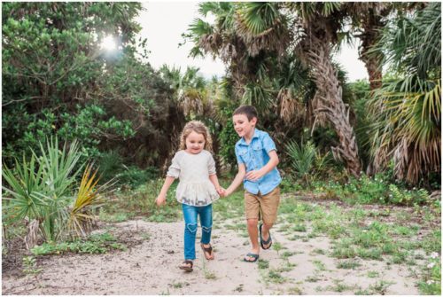 Melbourne Family Photographer brother and sister holding hands on path photo by Liz Cowie Photography