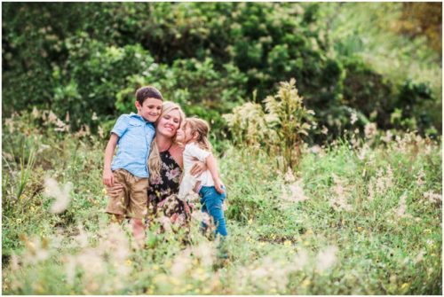 Melbourne Florida Family Photographer mom getting kisses from kids photo by Liz Cowie Photography