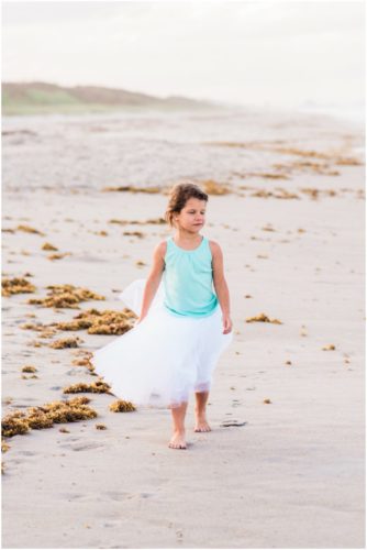 cute girl walking on beach during Melbourne Beach Family Photography session