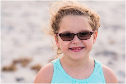 Close up of girl with blue shirt during Melbourne Beach Family Photography session