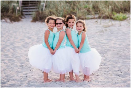 Little girl cousins holding hands during Melbourne Beach Family Photography session