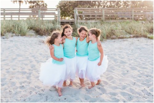 Girls walking by dunes during Melbourne Beach Family Photography session