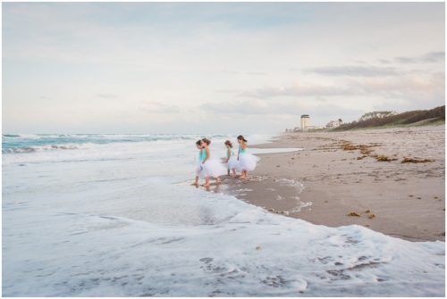 Girls standing by ocean during Melbourne Beach Family Photography session