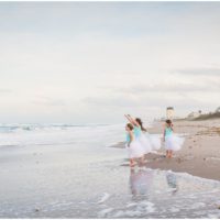 Girls standing by ocean during Melbourne Beach Family Photography session