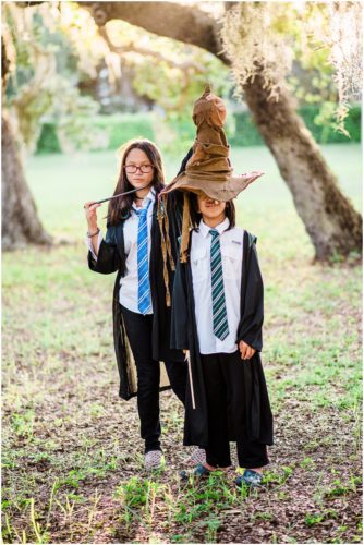 Fun Family Portraits son getting sorted by Harry Potter hat