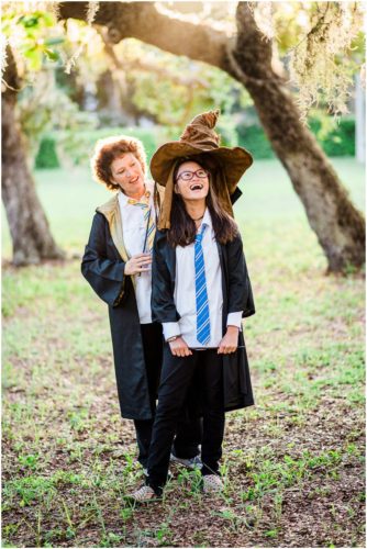 Fun Family Portraits Girl getting sorted by Harry Potter hat