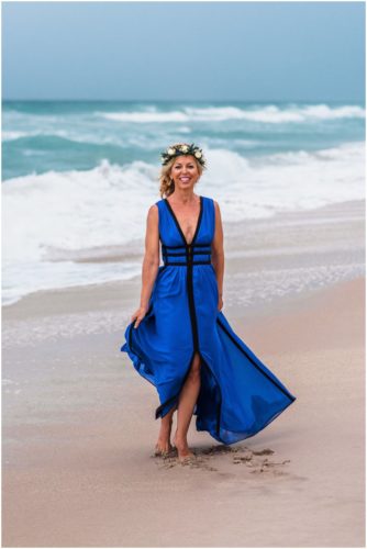 Bride spinning in electric blue dress during Melbourne Beach Florida engagement session