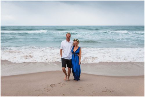 Couple laughing in the rain during Melbourne Beach Florida engagement session