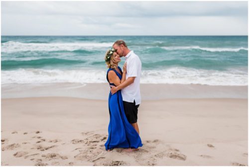 Couple hugging with ocean during Melbourne Beach Florida engagement session