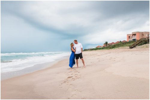 couple standing on beach during storm during Melbourne Beach Florida engagement