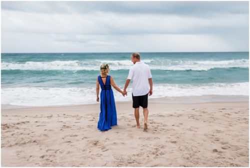 Walking toward the water during Melbourne Beach engagement session