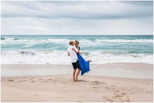 Groom spinning bride during Melbourne Beach engagement session