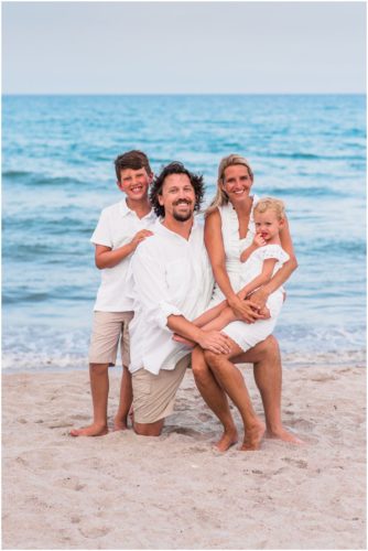 Whole family with ocean in the background during Melbourne Beach Family Portraits