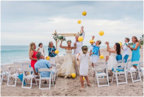 throwing beach balls during gorgeous melbourne beach wedding