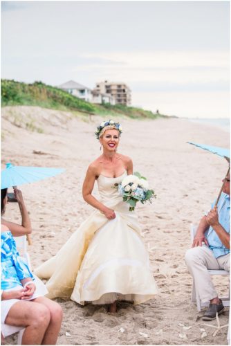 Bride walking on sand during gorgeous Melbourne Beach wedding