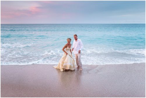 Couple playing by ocean during gorgeous Melbourne Beach wedding