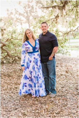 Couple arm in arm under oak trees during Vero Beach engagement
