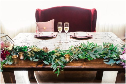 Head table with greenery at Up the Creek Farms Wedding
