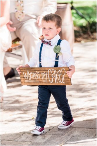 Little boy with sign at Up the Creek Farms Wedding
