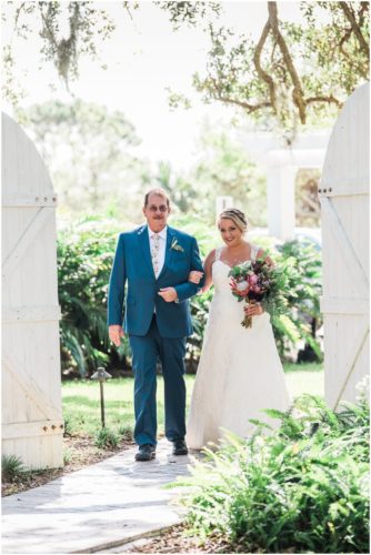 Bride walking down asile with father at Up the Creek Farms Wedding