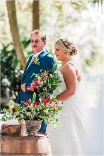 Bride walking down asile with father at Up the Creek Farms Wedding