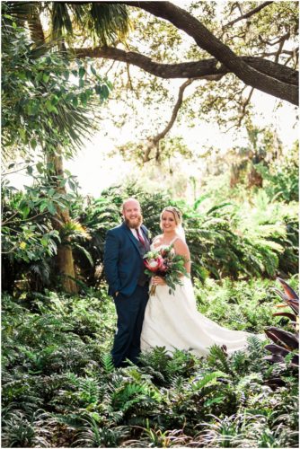 Bride and groom in ferns at Up the Creek Farms Wedding