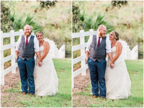 Bride and groom by white fence at Up the Creek Farms Wedding