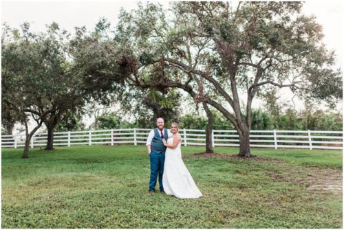 Bride and groom with oak trees at Up the Creek Farms Wedding