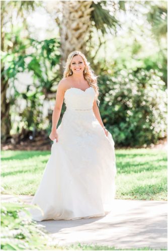 Bride walking in wedding gown during a beautiful Up the Creek Farms Wedding