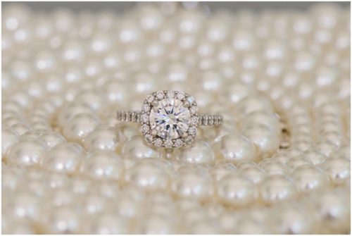 Engagement ring on pearl bag during a beautiful Up the Creek Farms Wedding