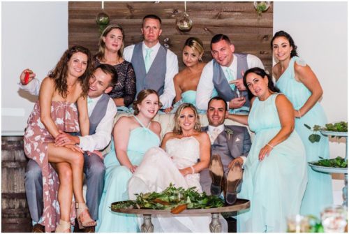 Group photo at reception during beautiful Up the Creek Farms Wedding