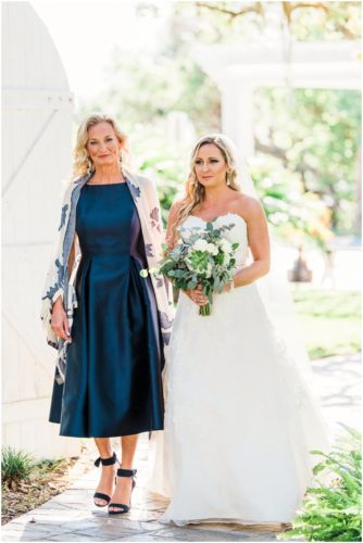 Mother walking daughter down the isle during beautiful Up the Creek Farms Wedding