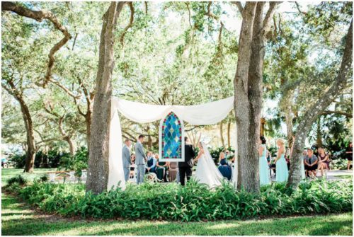 Ceremony under the oaks during beautiful Up the Creek Farms Wedding