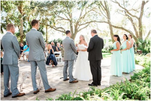 Wedding ceremony under the Oak trees during beautiful Up the Creek Farms Wedding
