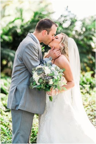 Bride and groom kissing during beautiful Up the Creek Farms Wedding
