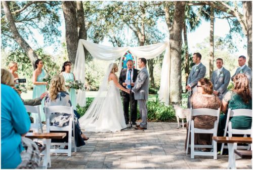 Ceremony under the oaks during beautiful Up the Creek Farms Wedding