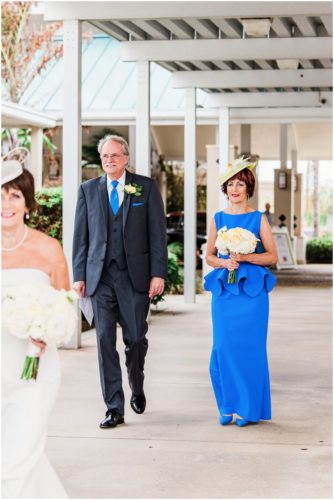 Bride and groom outside by boats Eau Gallie Yacht Club Wedding