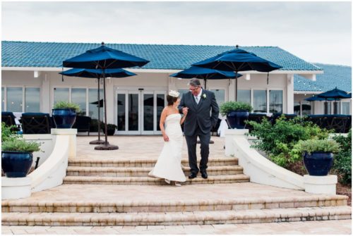 Bride and groom outside by boats Eau Gallie Yacht Club Wedding
