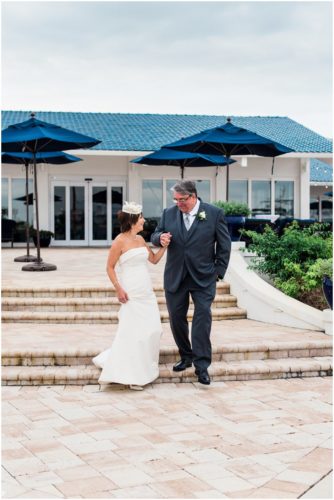Bride and groom outside by boats Eau Gallie Yacht Club Wedding