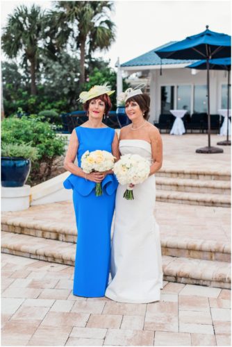 Bride and groom outside by boats Eau Gallie Yacht Club Wedding