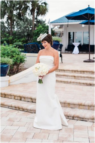 Bride and groom outside by boats Eau Gallie Yacht Club Wedding