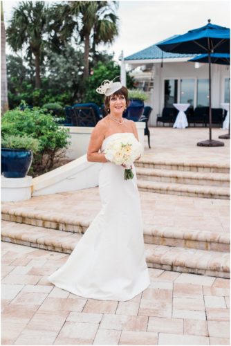 Bride and groom outside by boats Eau Gallie Yacht Club Wedding
