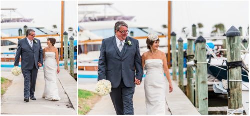 Bride and groom outside by boats Eau Gallie Yacht Club Wedding