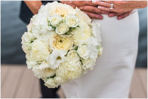 Bride and groom outside by boats Eau Gallie Yacht Club Wedding