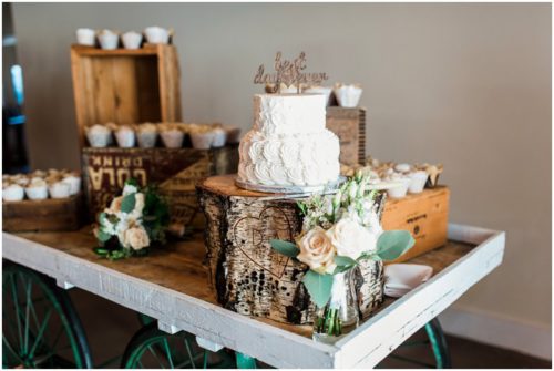 Wedding cake on tree stump stand during a Up the Creek Farms Wedding