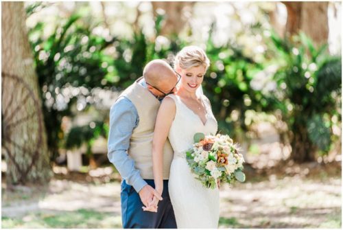 Groom kissing brides neck during a Up the Creek Farms Wedding