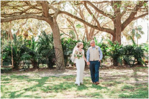 couuple walking together by swing during a Up the Creek Farms Wedding